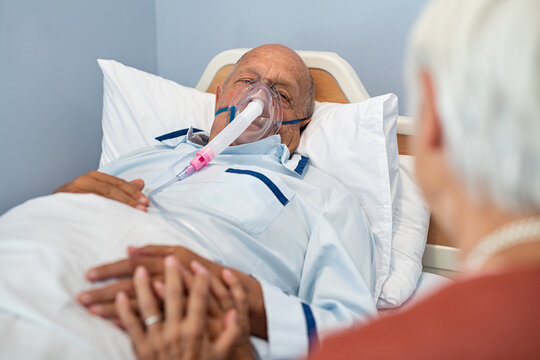 Woman Visit Senior Husband With Oxygen Mask At Hospital