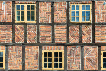 Old fashioned Timber Frame Facade with Classic Bricks Pattern in Town Lund, Skane Sweden.