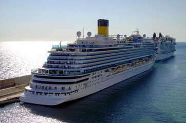 Huge modern Costa cruiseship cruise ship liner Firenze in port of Civitavecchia, Italy awaiting...