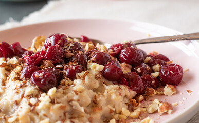 Oatmeal with cherries, nuts and flaxseeds