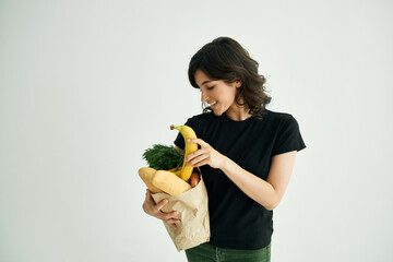 Fototapeta premium cheerful woman in a black t-shirt food healthy food