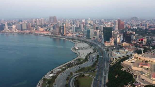 Fast motion traveling front, Luanda city, golden hour flying over Luanda bay, Africa #