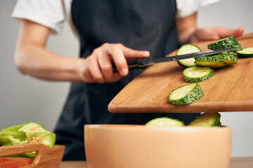 housewife in the kitchen cutting vegetables healthy eating vitamins