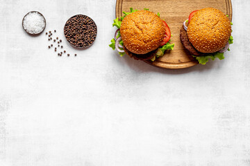Sandwiches hamburger with chicken burger and green salad. Overhead view