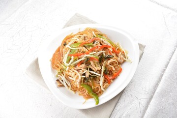 wok fried bee hoon vermicelli thin noodle with seafood and vegetables in chef dark soy sauce in white background asian halal menu