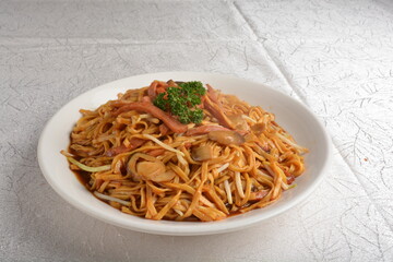 braised ee-fu thick udon noodle with seafood prawn and mushroom in dark soy sauce in white background asian halal menu