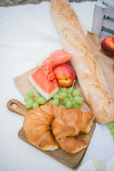 A beautiful picnic near the lake. Pastries, fruits, watermelon. Summer. Lemonade.