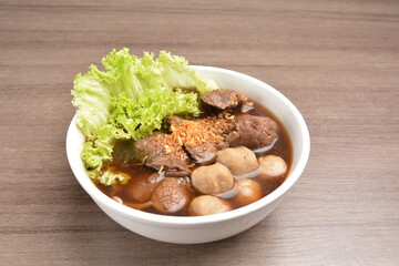 Vietnamese braised beef meat ball hot soup bowl in wood background asian halal menu
