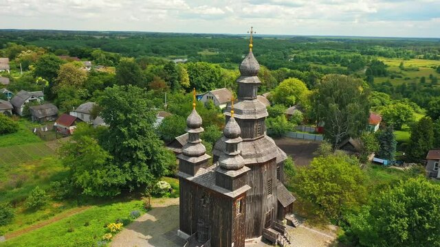 Rural landscape flying around the old wooden church.