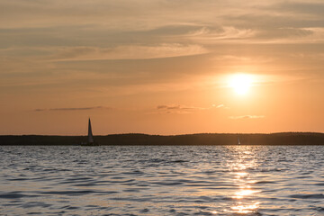 The orange sunset and the sail over the Minsk sea, Belarus