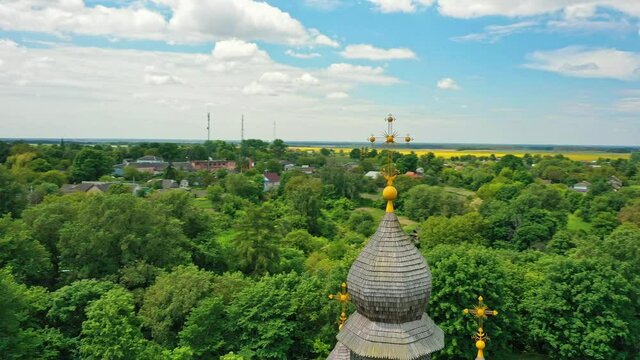 Rural landscape flying around the old wooden church.