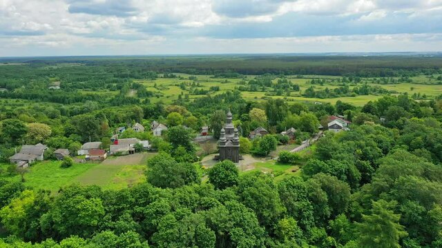 Rural landscape flying around the old wooden church.
