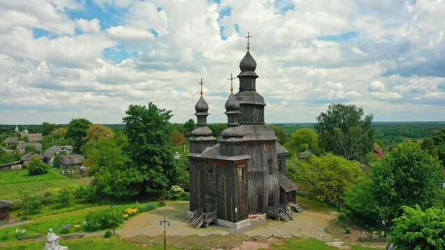 Rural landscape flying around the old wooden church.