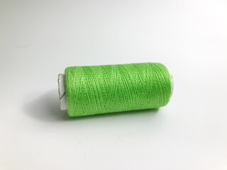 green thread on a white background isolated