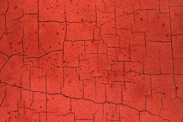 Old Red Cracked Stucco Texture Background. Wall with cracks. Red plaster texture background. Abstract grunge decorative dark red stucco wall background. Art rough stylized texture banner, copy space. 