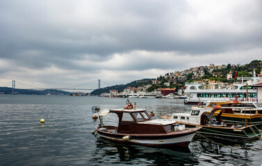 the scenery of Bosphorus and boats in the harbor on a cloudy day in Istanbul