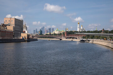 Beautiful Moscow Kremlin on the river bank. High towers. Sunny day. Ancient architecture. Center of Moscow.