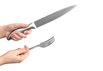 Kitchen utensil. Stainless steel knife and fork in woman hand, isolated on a white background photo