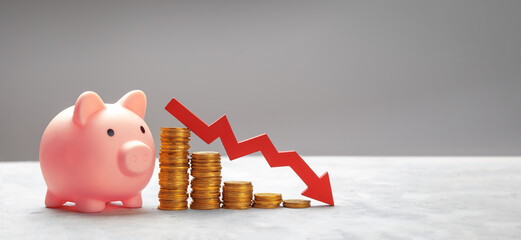 Piggy bank with coins and graph arrow downward. Falling savings or bankruptcy and loss of...