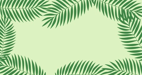 Composition of green leaves forming frame with copy space on green background