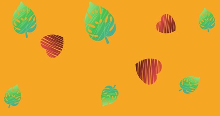 Composition of green leaves and red hearts on orange background