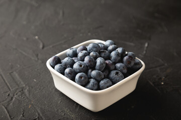 Fresh blueberries on black table