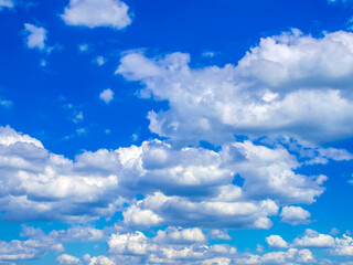 bright blue sky with white fluffy clouds