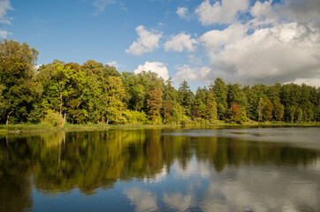 Fototapeta na wymiar Kazdanga village mill lake in sunny autumn day, Latvia.