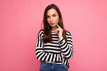 Portrait of amazing thoughtful beautiful young woman deep thinking creative female person holding arm on chin wearing stylish outfit isolated on colorful background with copy space