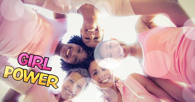 Animation of girl power text diverse over group of diverse group of smiling women