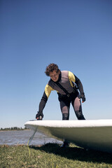 Windsurfer surfing on a windy summertime day at the river.