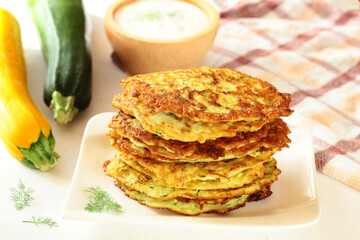 Zucchini pancakes with yoghurt-herb dip