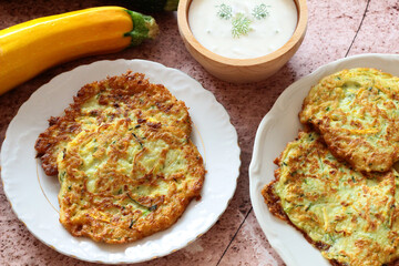 Zucchini pancakes with yoghurt-herb dip