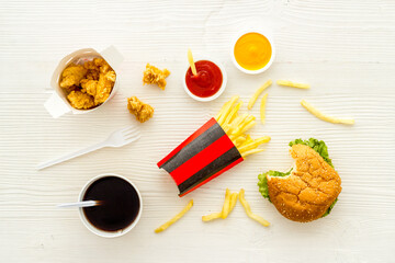 Fast food background. Hamburger chicken nuggets and french fries