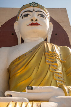 The large Buddha statue in the Kyaik Pun Pagoda a small Buddhist monastery near the town of Bago, Myanmar