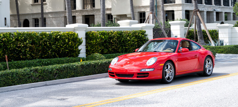 Palm Beach, Florida USA - March 21, 2021: red Porsche 997 Carrera luxury