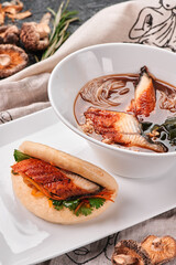 Miso Ramen Asian noodles with eel in bowl on dark background. Japanese cuisine. Top view. Banner. Traditional dish of Japanese, Chinese and Korean cuisine. High quality photo