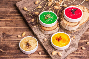 Chickpea hummus backdrop, assorted flavor on vintage wooden table