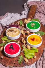 Colorful hummus bowls, healthy vegan dips