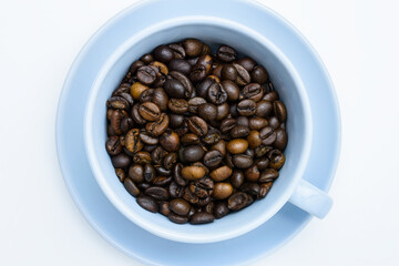 coffee beans in a bright cup on a white background
