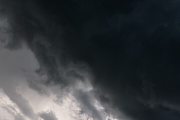 Dark sky and a sharp black cloud before the rain