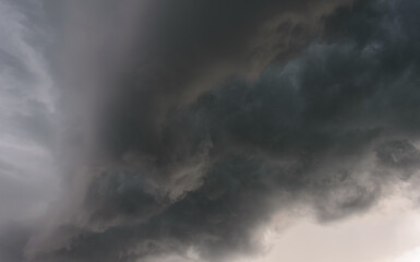 Dark sky and a sharp black cloud before the rain