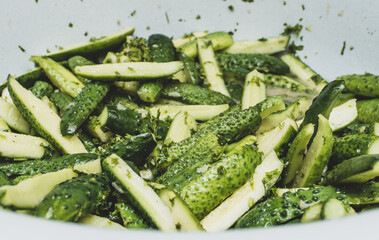 Cucumber salad in its own juice. pickled for packaging in jars for long-term storage