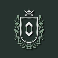 Vintage premium monogram of letter O. Heraldic coat of arms in form of shield surrounded by floral ornament and crown.