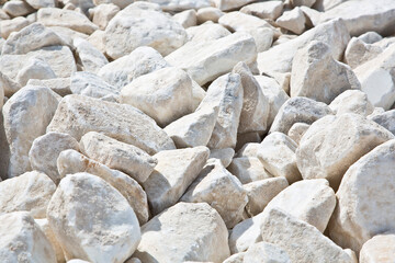 Expanse of white different sizes gravel in a construction site used in the construction industry and building activity for the construction of roadbeds