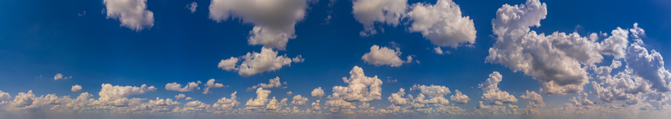 Wide panorama of blue sky with  white clouds in the afternoon