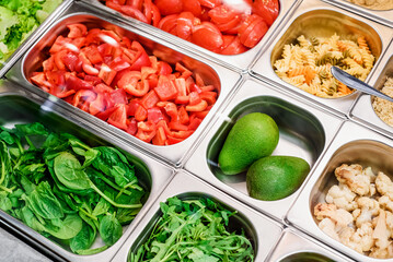 Showcase salad bar with an assortment of ingredients for healthy and dietary food. Salad take away. High quality photo