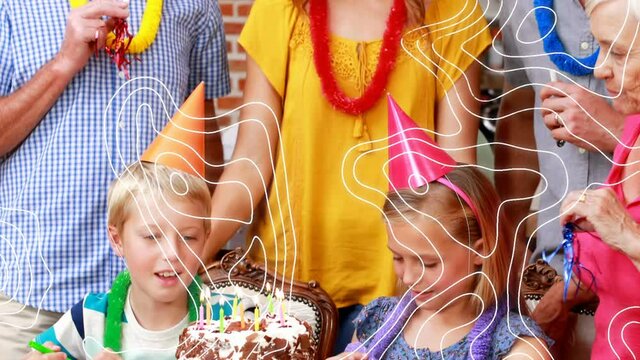 Animation of shapes moving over happy family at birthday party