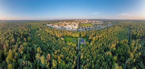 Drone panorama of the city of Langen in southern Hesse taken in the evening - obrazy, fototapety, plakaty