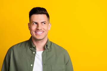 Fototapeta premium Photo portrait smiling man wearing shirt looking copyspace isolated bright yellow color background